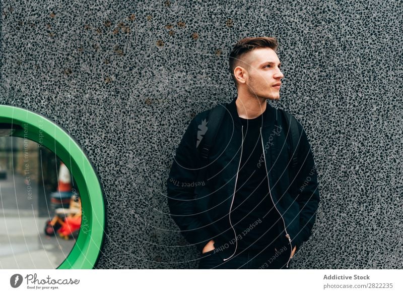 Young man in black on street Man traveler Town Dream London Style England handsome contemplate Considerate hands in pockets Black Jacket Wall (building) Lean