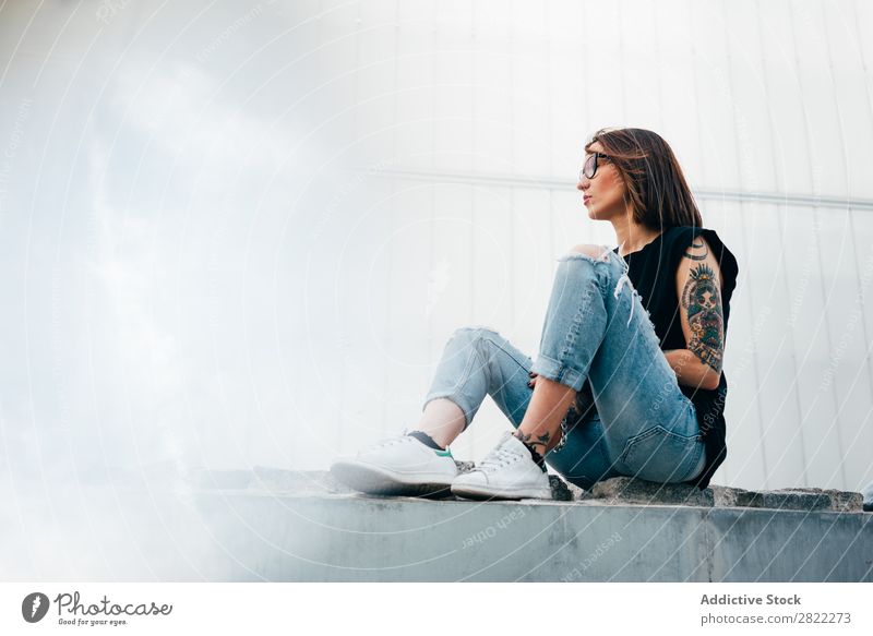 Unrecognizable tattooed woman on pavement Woman Style Tattoo Sit Old Relief Pavement Street Beautiful Youth (Young adults) Fashion Hipster pretty Cool (slang)