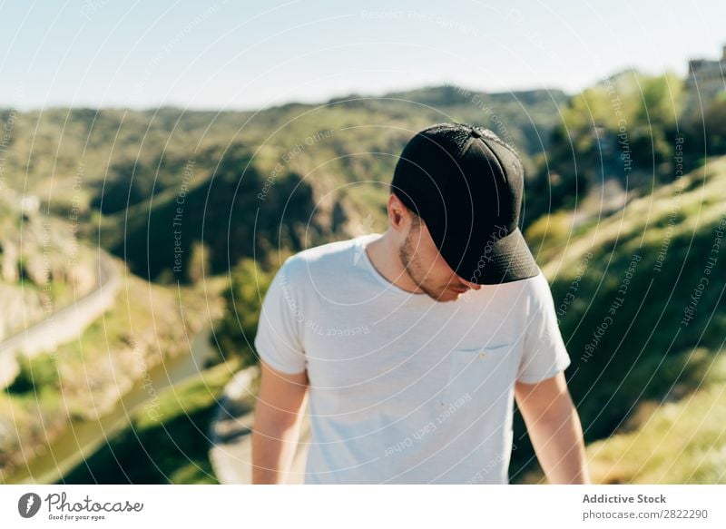 Cheerful man in mountains Man Mountain Cap Happy Youth (Young adults) Adventure Nature Healthy Vacation & Travel Human being Lifestyle Portrait photograph