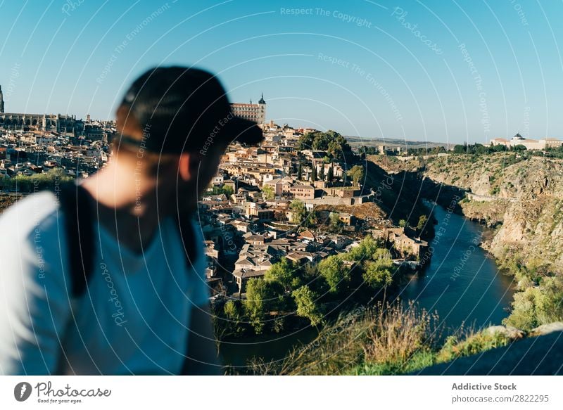 Man looking at mountain town Tourist Mountain Town Tourism Landscape Nature Vacation & Travel City Landmark Blue Skyline Beautiful Hiking Vantage point