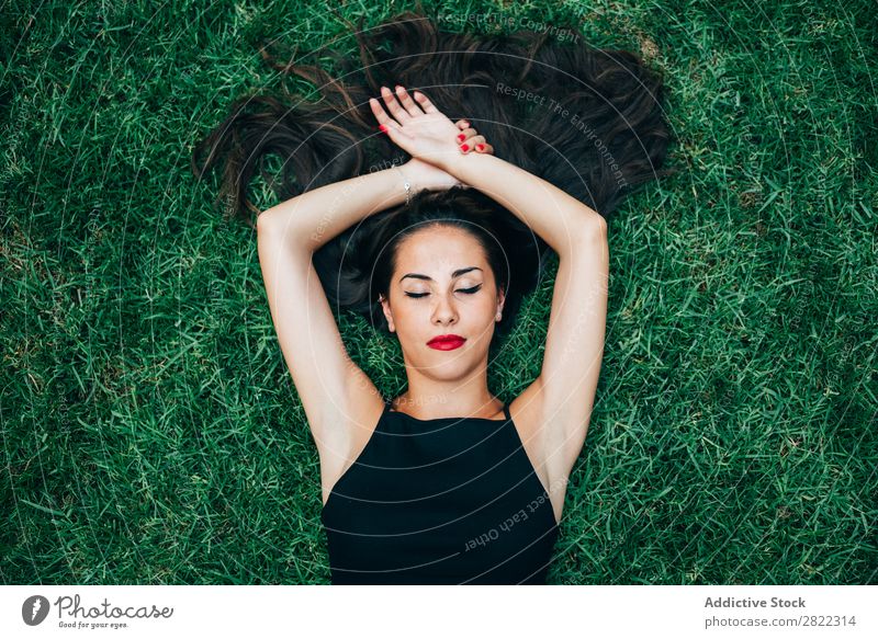 Cheerful brunette woman lying in grass Woman pretty Youth (Young adults) Beautiful Lie (Untruth) Grass Nature Brunette Attractive Human being Beauty Photography