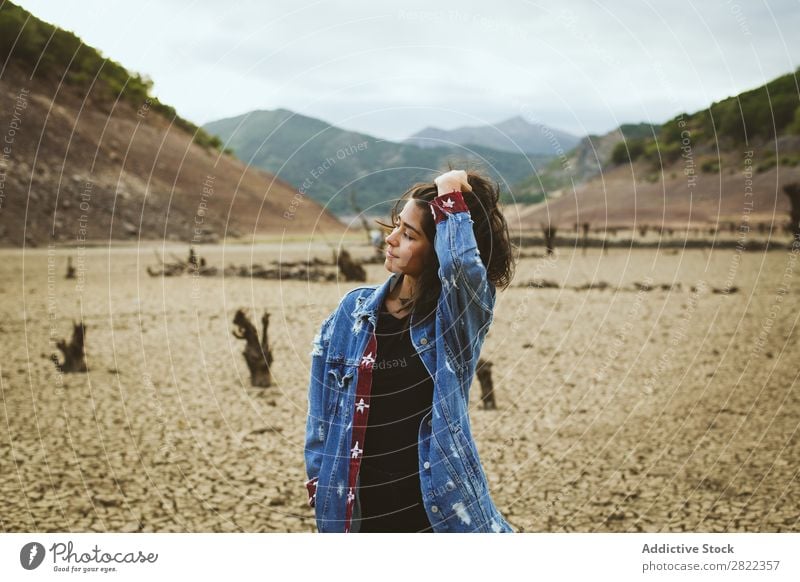 Woman posing in hills Hill Stand Dream Looking away Youth (Young adults) Mountain Vacation & Travel Freedom Action Tourist Adventure Rock Vantage point Hiking