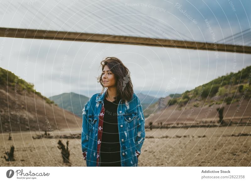 Woman standing at bridge in hills Hill Stand Bridge Construction Dream Looking away Youth (Young adults) Mountain Vacation & Travel Freedom Action Tourist