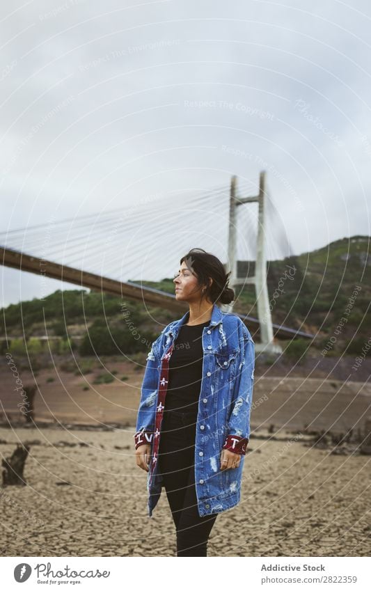 Woman standing at bridge in hills Hill Stand Bridge Construction Dream Looking away Youth (Young adults) Mountain Vacation & Travel Freedom Action Tourist