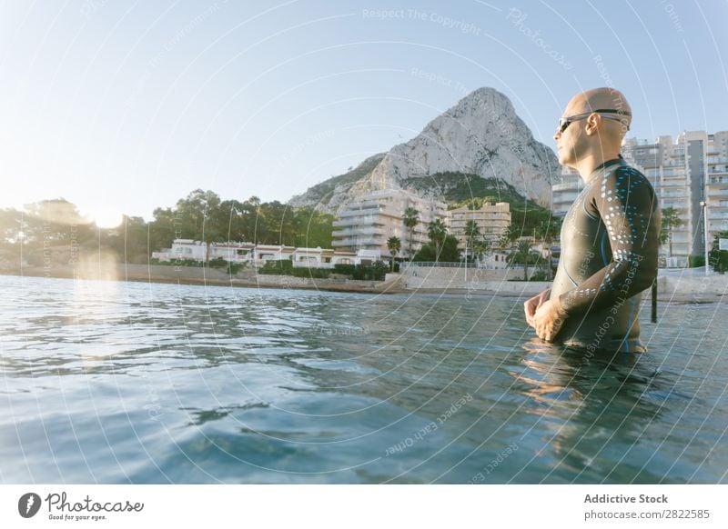 Diver entering the sea Man Wetsuit Ocean Vacation & Travel Relaxation Water Swimming Action Sports Beach Splashing Freedom Adventure Leisure and hobbies Nature