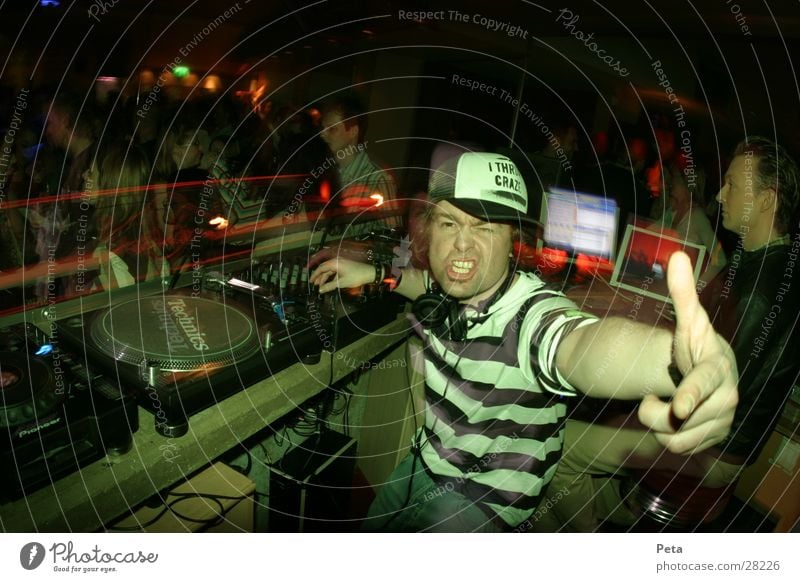 ROCKDJ Disco Music Man Party Party mood Party goer Disc jockey Baseball cap Striped Facial expression Gesture Signal Wild Interior shot Looking into the camera