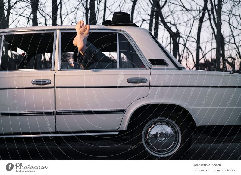 Man sleeping in vintage car Car Vintage Retro Sleep Lie (Untruth) Rest Relaxation Legs Hat White Vehicle Classic Old Adults Vacation & Travel Human being