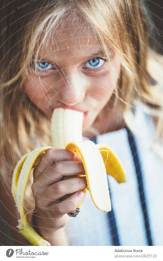 Girl eating banana outside Banana Fruit Garden Posture Portrait photograph Refreshment Eating Fresh Summer Style Rural Healthy Organic Yellow Landscape Nature