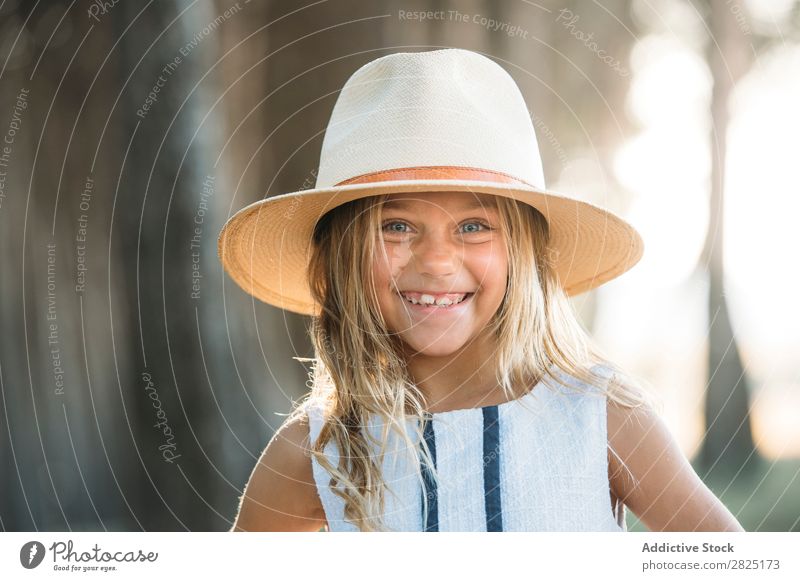 Smiling kid in hat outside Child Cheerful Playful Portrait photograph Happiness Posture Style Hat Self-confident Cowboy Laughter Girl Delightful Summer