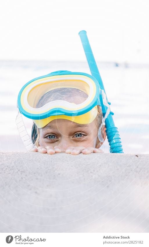 Kid in snorkel mask posing on poolside Child Swimming pool Mask Relaxation Vacation & Travel Posture human face Leisure and hobbies Dive Contentment Cheerful