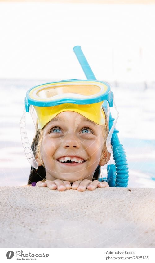 Kid in snorkel mask posing on poolside Child Swimming pool Mask Relaxation Vacation & Travel Posture human face Leisure and hobbies Dive Contentment Cheerful