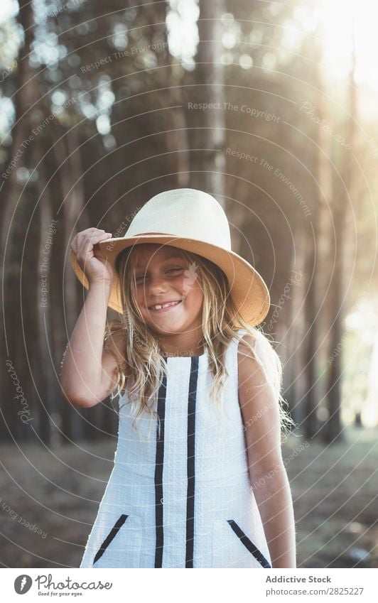 Charming girl posing with hat Girl Summer Style Nature Playful Child Delightful Infancy Posture Adventure Hip & trendy Cheerful Hat Hold coquette Landscape Joy