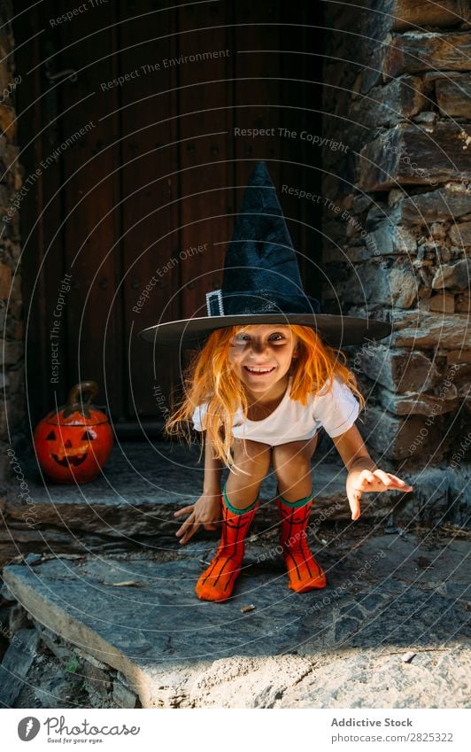 Adorable girl posing playfully Girl Hallowe'en pretend terrify Posture Portrait photograph Cheerful House (Residential Structure) Costume Feasts & Celebrations