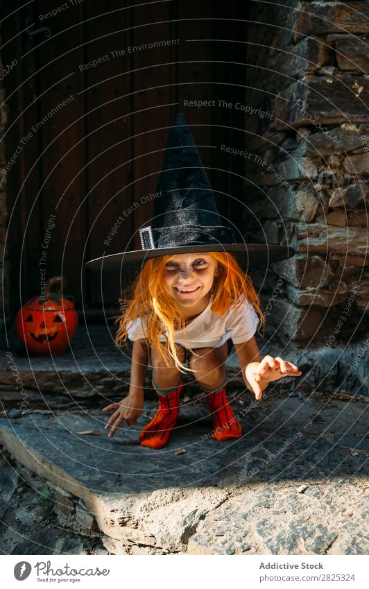 Adorable girl posing playfully Girl Hallowe'en pretend terrify Posture Portrait photograph Cheerful House (Residential Structure) Costume Feasts & Celebrations