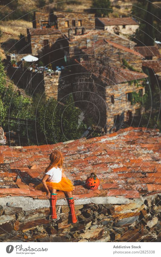 Girl in costume posing on roof Costume Hallowe'en Playful rooftop Feasts & Celebrations Posture Intellect Tradition Expression Seasons Guest Street Infancy