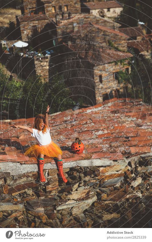 Girl in costume posing on roof Costume Hallowe'en Playful rooftop Feasts & Celebrations Posture Intellect Tradition Expression Seasons Guest Street Infancy