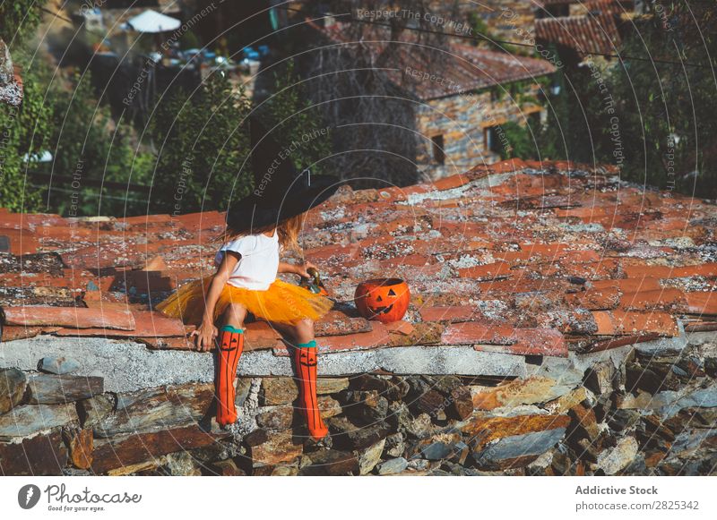 Girl in costume posing on roof Costume Hallowe'en Playful rooftop Feasts & Celebrations Posture Intellect Tradition Expression Seasons Guest Street Infancy