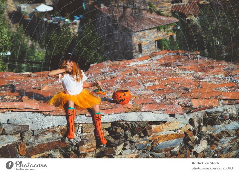 Girl in costume posing on roof Costume Hallowe'en Playful rooftop Feasts & Celebrations Posture Intellect Tradition Expression Seasons Guest Street Infancy