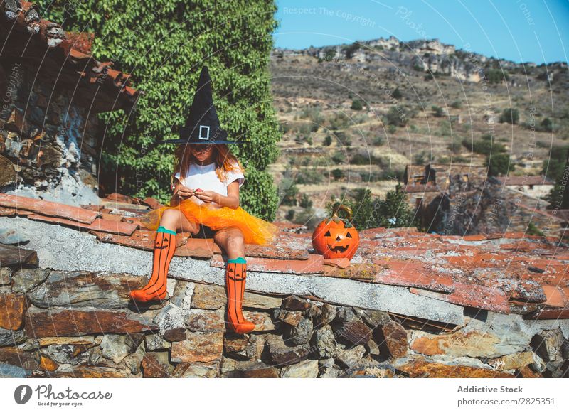 Girl in costume posing on roof Costume Hallowe'en Playful rooftop Feasts & Celebrations Posture Intellect Tradition Expression Seasons Guest Street Infancy