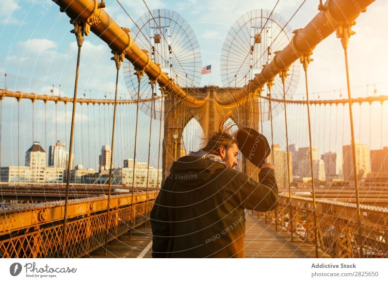 Man walking on bridge Hat Bridge bearded Self-confident Earnest Brutal Beard Human being City Hipster Adults Easygoing Lifestyle Portrait photograph handsome