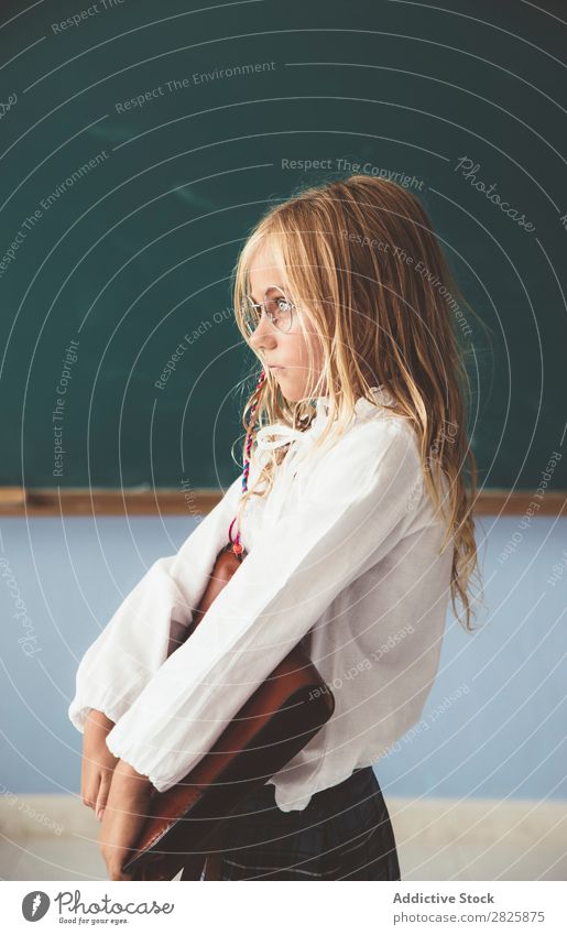 Pupil at chalkboard with briefcase in hand Girl Classroom Blackboard Stand Cheerful Happy Book Chalk Cute Education School Grade (school level) Student