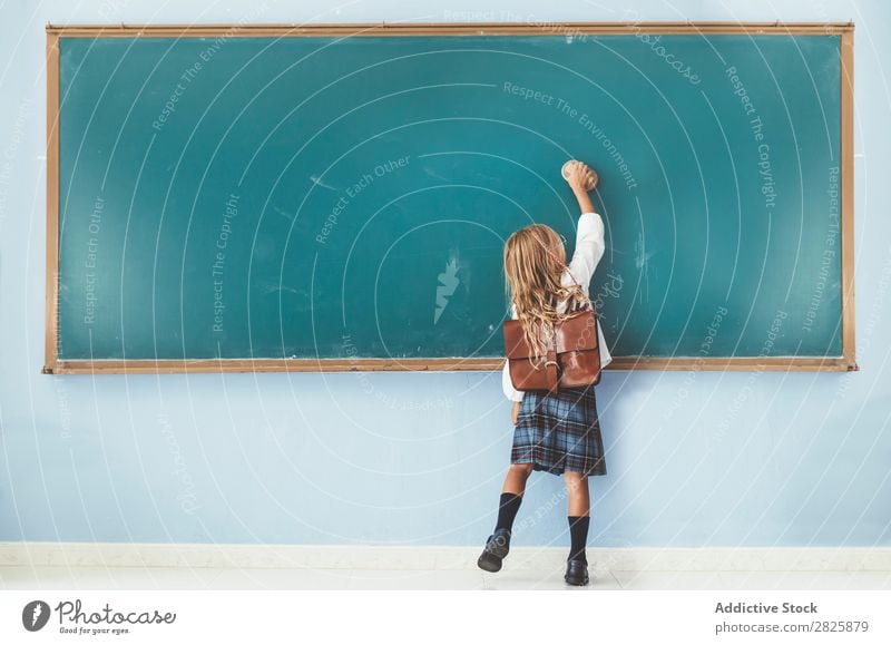 Pupil writing on the blackboard Girl Classroom Blackboard Stand Cheerful Happy Book Chalk Cute Education School Grade (school level) Student