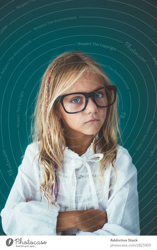 Cute schoolgirl posing in a classroom Girl Classroom Blackboard Person wearing glasses Cheerful Stand Education School Grade (school level) Student