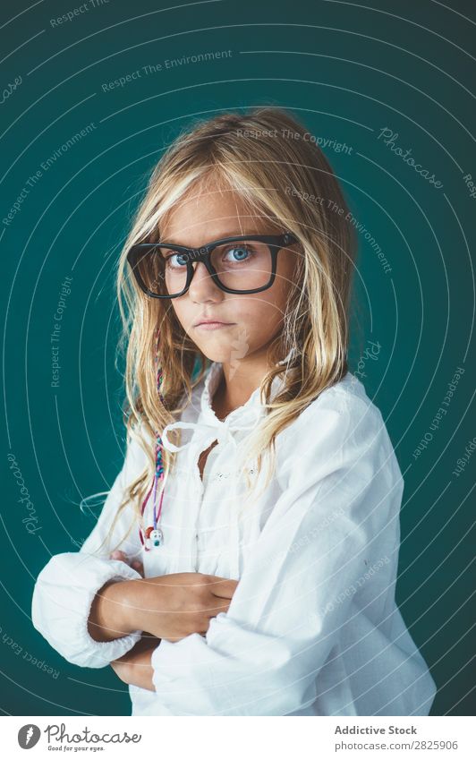 Cute schoolgirl posing in a classroom Girl Classroom Blackboard Person wearing glasses Cheerful Stand Education School Grade (school level) Student