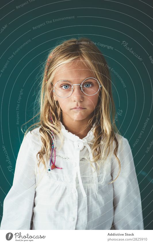 Cute schoolgirl posing in a classroom Girl Classroom Blackboard Person wearing glasses Cheerful Stand Education School Grade (school level) Student