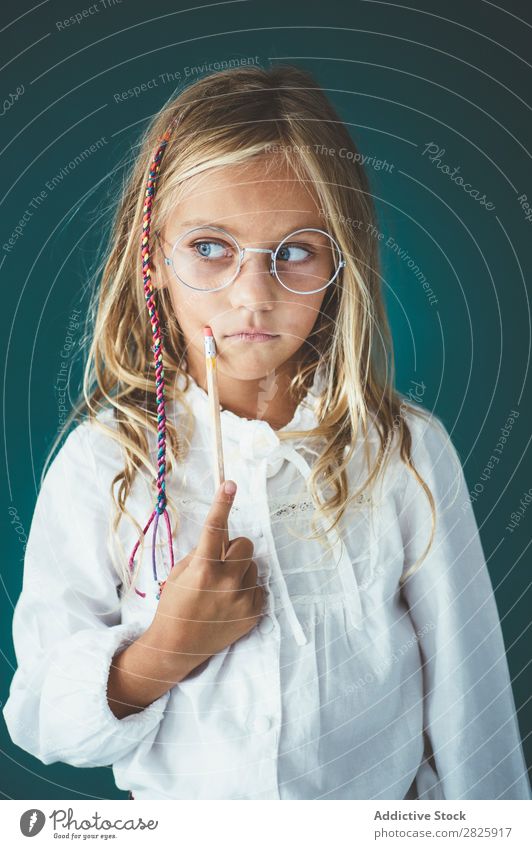 Cute schoolgirl with pencil Girl Classroom Blackboard Person wearing glasses Pencil Cheerful Stand Education School Grade (school level) Student