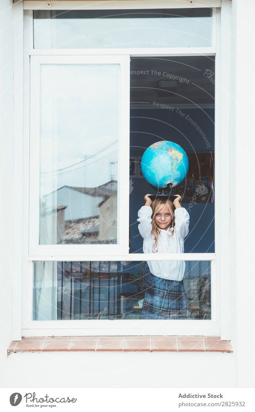 Schoolgirl posing with globe Girl Classroom Globe Window Map Posture Stand Cute Education Grade (school level) Student Youth (Young adults) Study Child Lessons