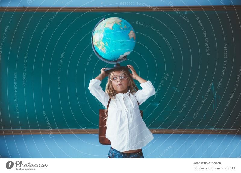 Pupil girl posing with globe Girl Classroom Globe Geography Cute Education School Grade (school level) Student Youth (Young adults) Study Child Lessons learn