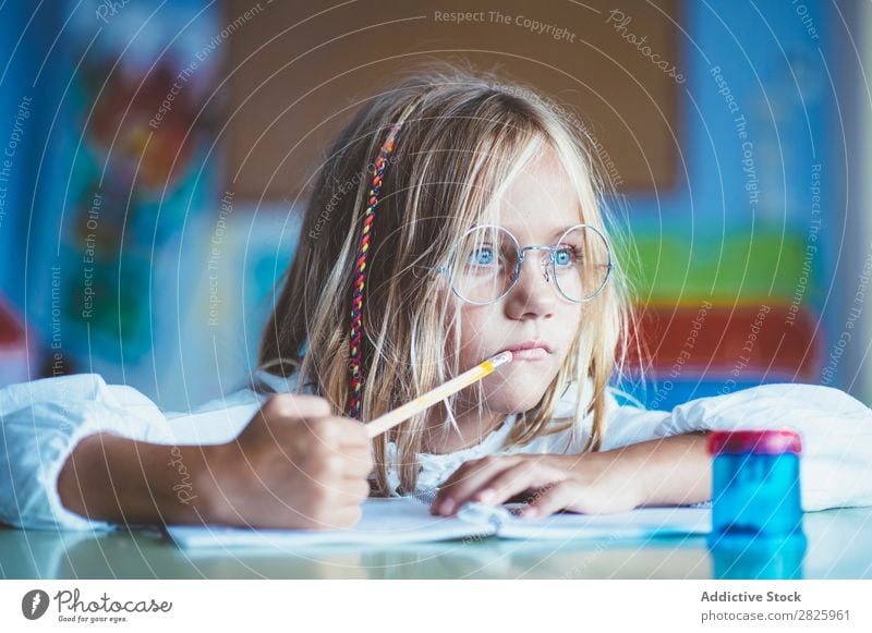 Thoughtful girl writing in class Girl Classroom Sit Desk Writing Pencil Drawing Think Considerate bored Cute Education School Grade (school level) Student