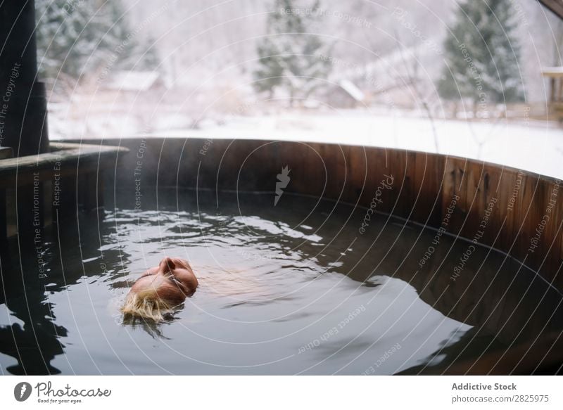 Woman relaxing in plunge tub Swimming Nature Winter Water Healthy Beautiful Vacation & Travel Romania Float in the water Snow Blonde Ice Natural Human being Wet