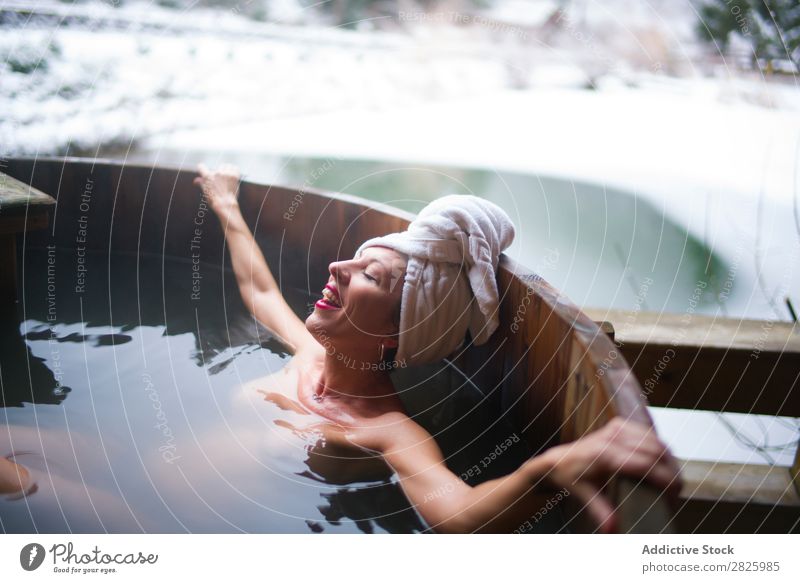 Cheerful topless woman in plunge tub Woman Swimming Nature Winter Lie (Untruth) Relaxation eyes closed Water Healthy Beautiful Vacation & Travel Romania