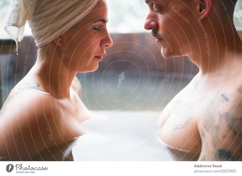 Sensual couple in plunge tub Couple Swimming Nature Winter Water Steam Woman Man Healthy Beautiful Vacation & Travel Romania Float in the water Snow Ice Natural