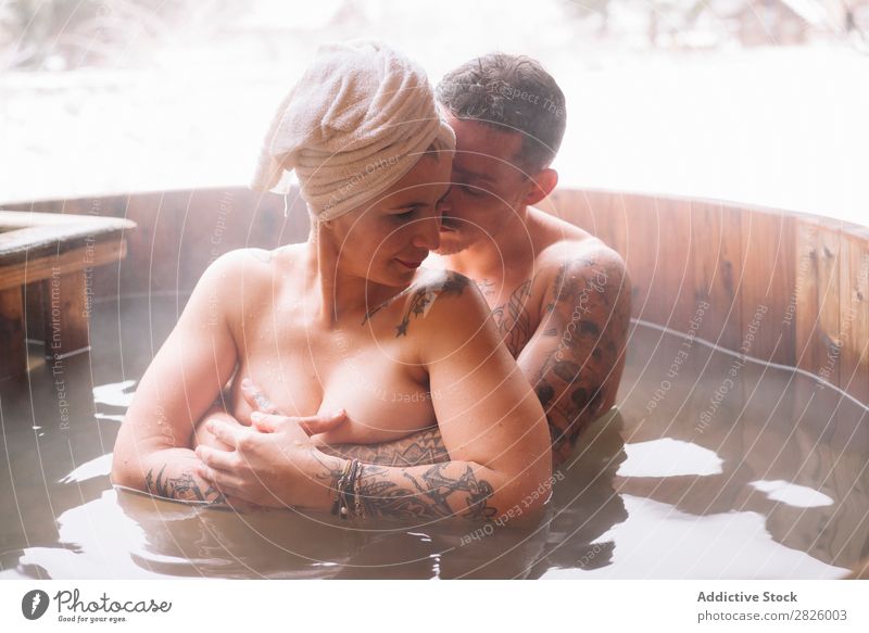 Sensual couple in plunge tub Couple Swimming Nature Winter Water Steam Woman Man Healthy Beautiful Vacation & Travel Romania Float in the water Snow Ice Natural