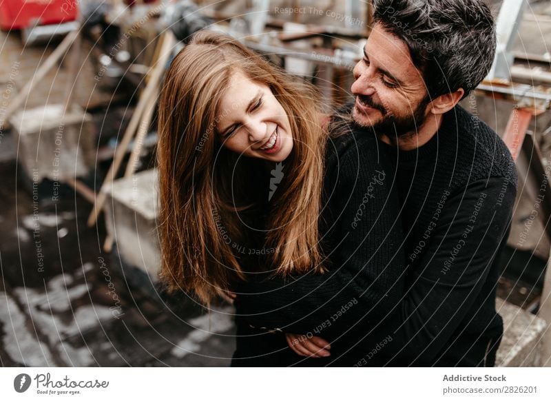 Young couple cuddling outdoors Couple Cuddling Kissing Embrace Love Together Roof Happy Relationship Beautiful girlfriend Happiness Adults Man