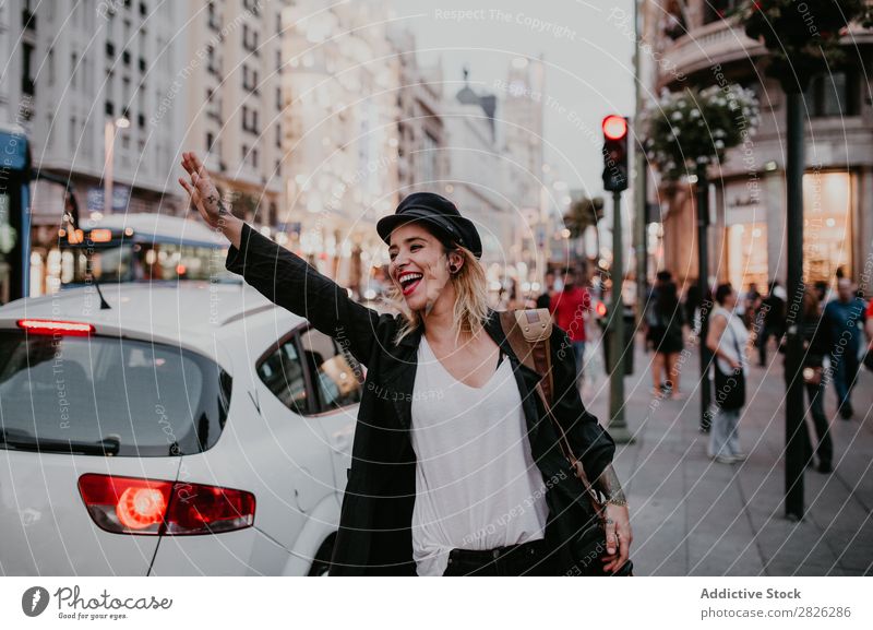 Woman taking taxi in city Taxi Take Street City Youth (Young adults) Lifestyle Vacation & Travel Car Girl Human being Transport Tourist Beautiful Town Tourism