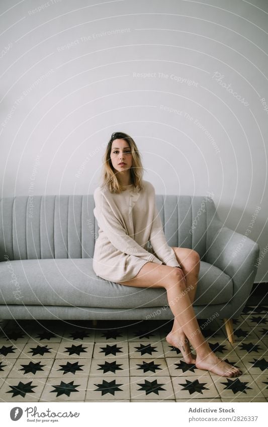 Woman sitting on couch Sit Sofa Portrait photograph Comfortable Couch Youth (Young adults) Home Pensive Considerate Attractive Beautiful Room Resting Easygoing