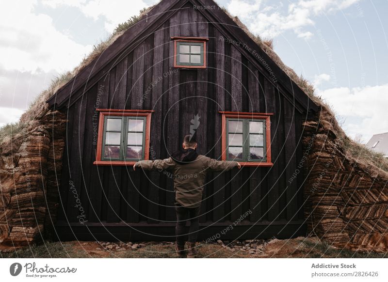 Anonymous man posing near old church Man Posture Church Attraction Ancient Iceland Tourism Vacation & Travel Landscape Landmark Exterior shot traveler Tourist