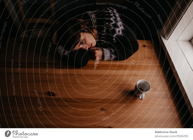 Woman lying on table with mug Table Sleep Iceland Home Morning exhausted Fatigue Dream asleep Stress Relaxation Interior shot Resting Mug Cup Refreshment