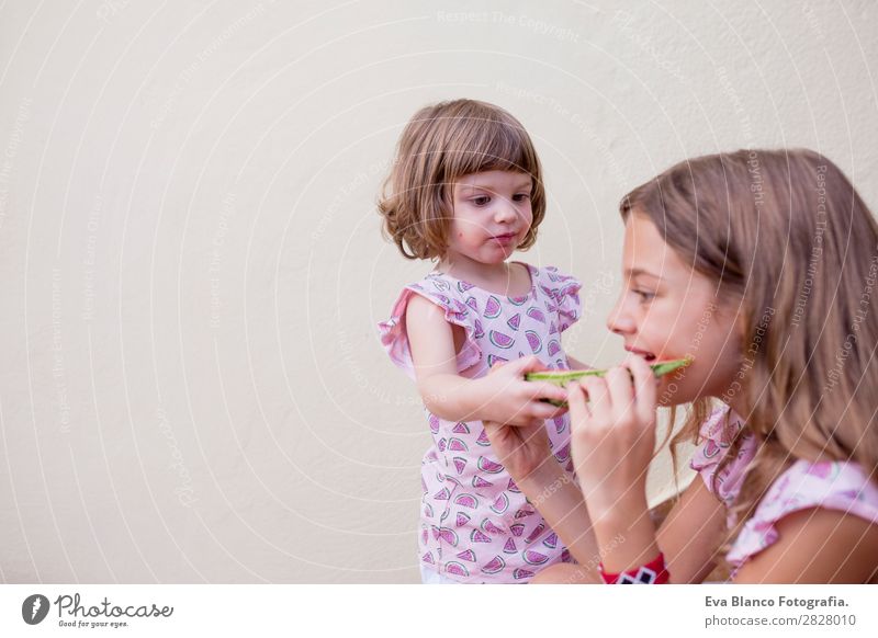 Two beautiful sister kids eating watermelon Fruit Ice cream Eating Joy Happy Vacation & Travel Summer House (Residential Structure) Garden Child Friendship