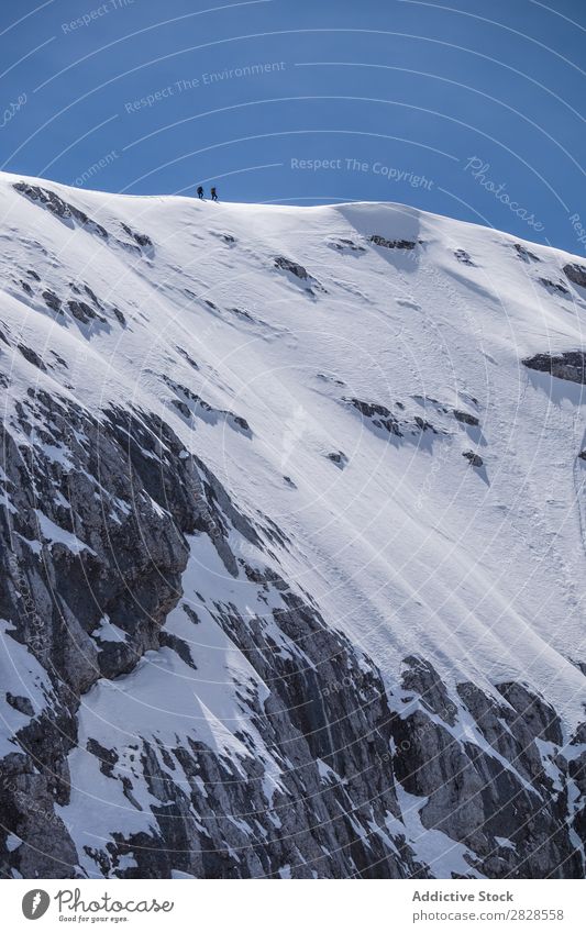 Tourists walking on peak Human being Snow Mountain Vacation & Travel Peak Winter Hiking Adventure Landscape Nature trekking Extreme hiker Mountaineering Cold