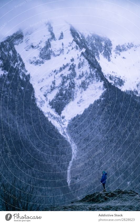 Tourist standing on cliff in winter Stand Cliff Mountain Winter Nature Hiking Walking Vacation & Travel Landscape Cold Snow Adventure hiker Lifestyle