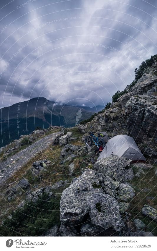 Tent and bike in mountains Bicycle Mountain Vacation & Travel Adventure Nature Ski-run Cycle Action Landscape Tourism Camping Motorcycling Extreme Relaxation