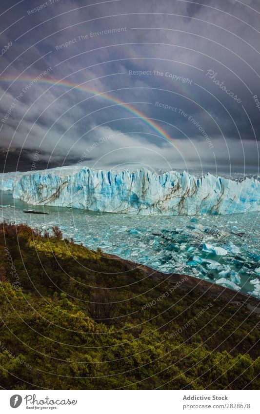 Rainbow above glacier Glacier Landscape Natural Wilderness Cloud cover Tourism Phenomenon Beauty Photography Forest snows Highlands Vacation & Travel Nature