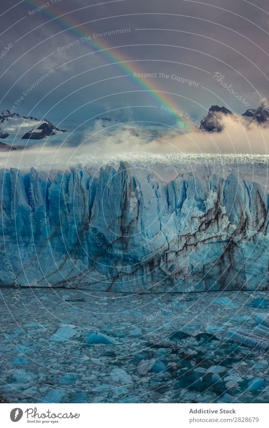 Rainbow above glacier Glacier Landscape Natural Wilderness Cloud cover Tourism Phenomenon Beauty Photography Forest snows Highlands Vacation & Travel Nature