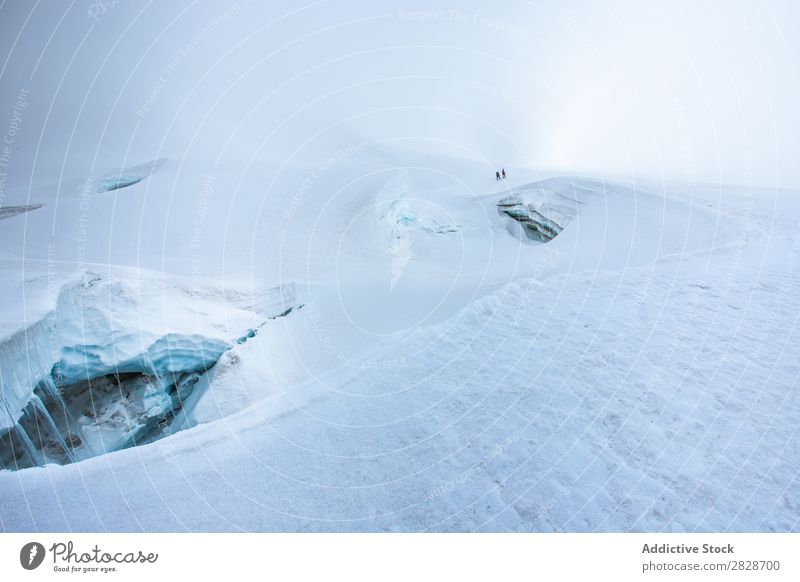 Figures of people far away in snows Highlands Glacier tourists Landscape Vacation & Travel Background picture Snow Nature Dramatic Panorama (Format) Freedom