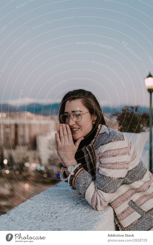 Cheerful young woman leaning on fence Woman pretty Youth (Young adults) Beautiful Fence Lean Town Street Smiling Person wearing glasses Brunette Attractive